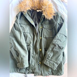Green winter coat with faux fur lining around hood